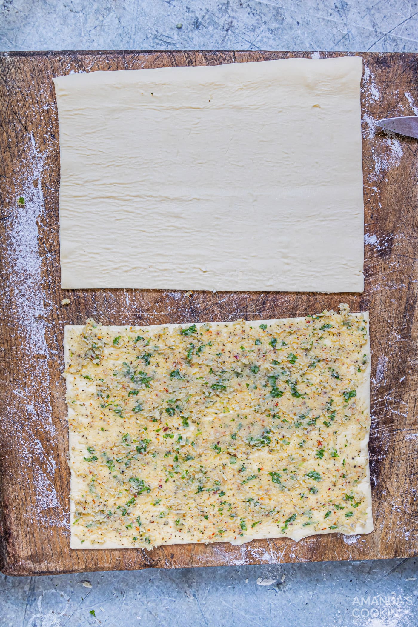 garlic butter smeared onto puff pastry sheet