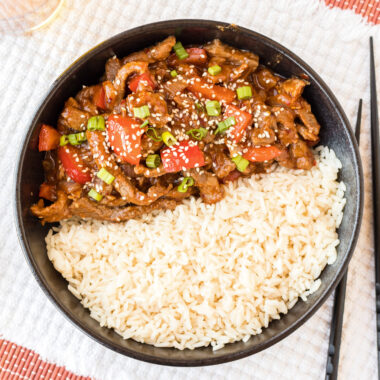 Beijing Beef served with rice in a bowl