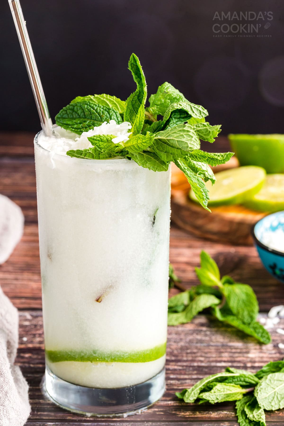 glass of coconut mojito garnished with mint