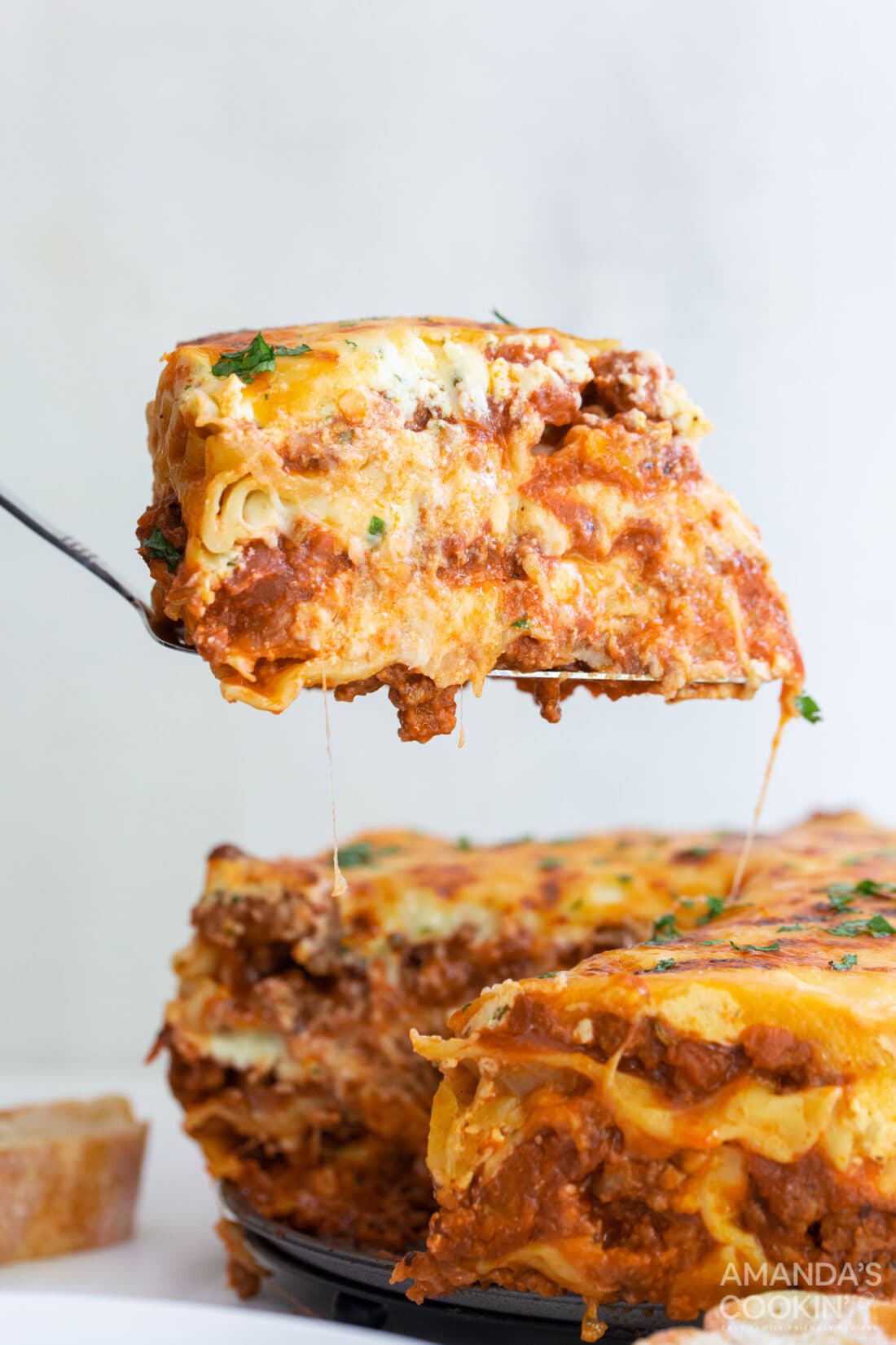 spatula lifting slice of Instant Pot Lasagna