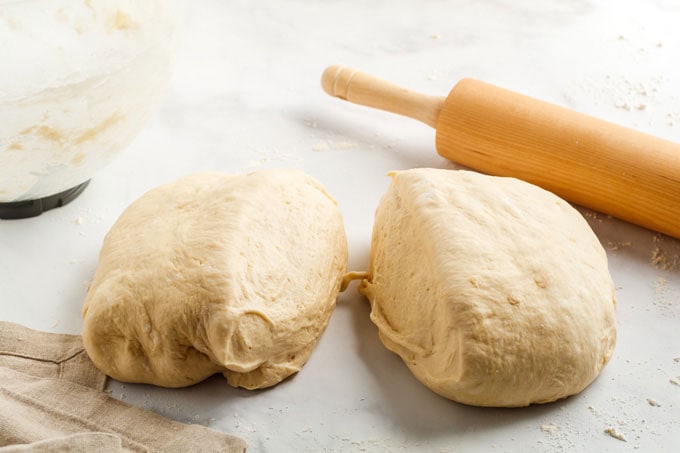 bread dough separated into two pieces