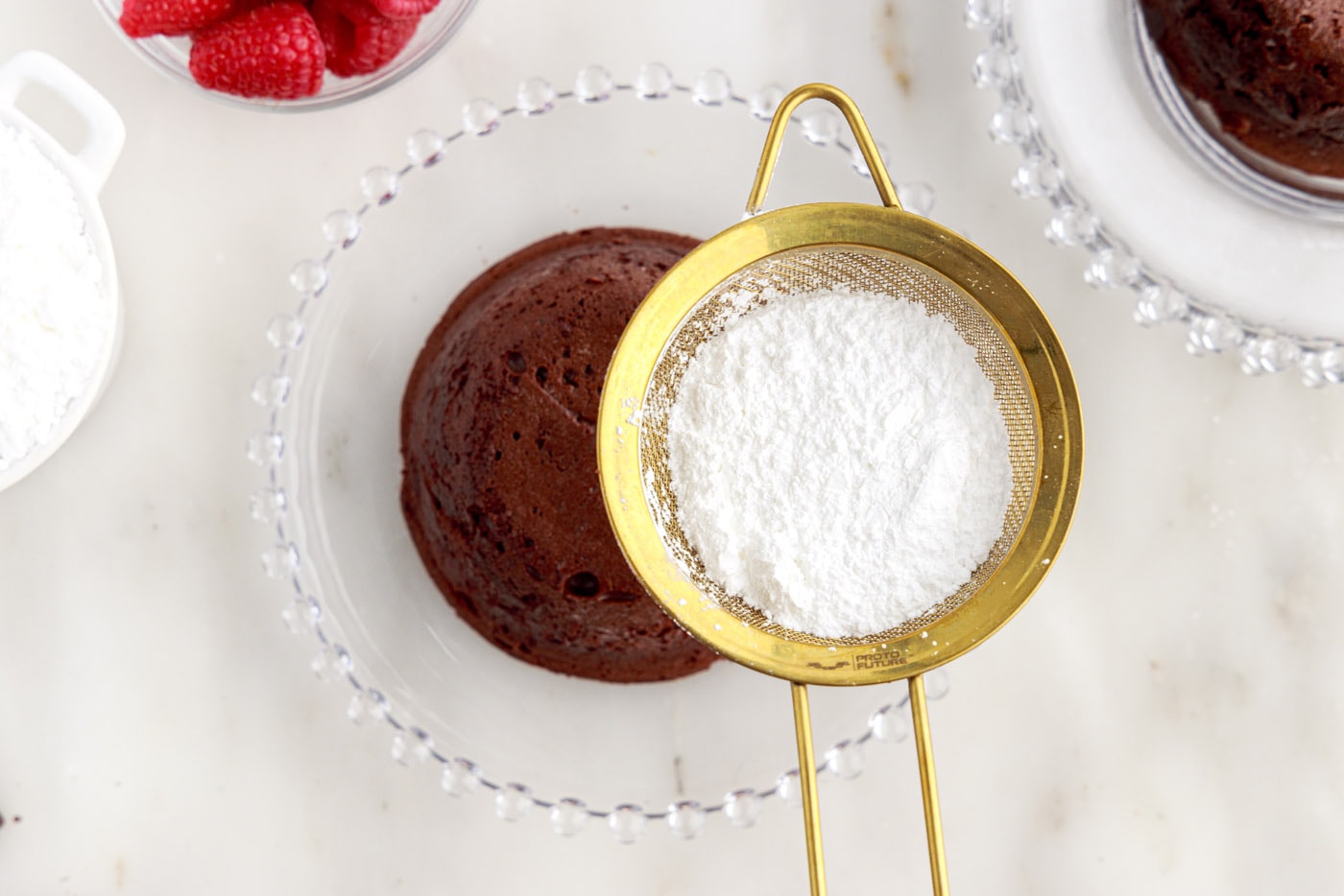 dusting lava cake with powdered sugar