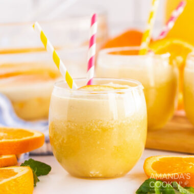 glass of orange punch with straws