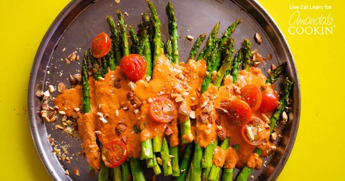This Roasted Asparagus side dish is covered in delicious and healthy Smoky Romesco Sauce, cherry tomatoes, and crunchy chopped almonds. So good!