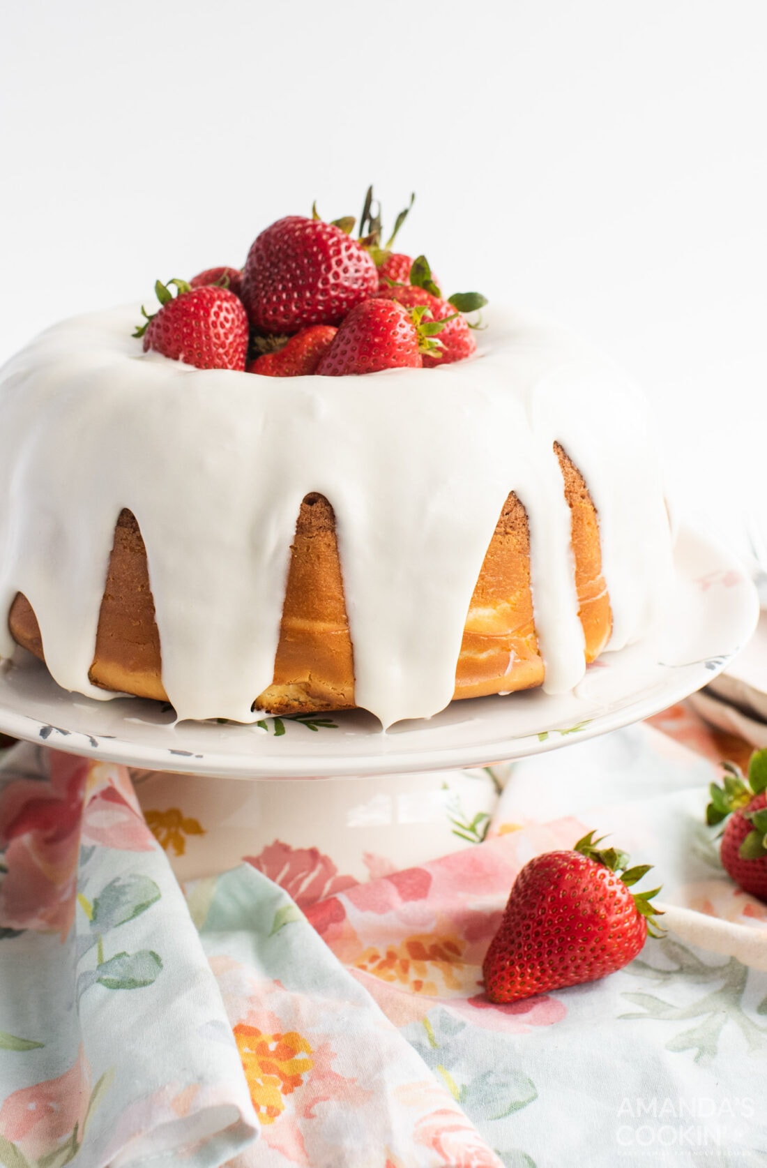strawberry bundt cake on a cake plate